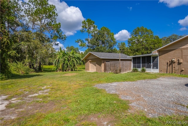 view of yard with a sunroom