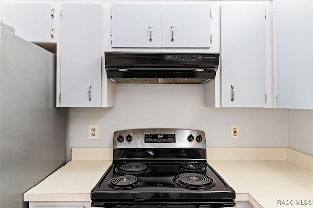 kitchen with light countertops, ventilation hood, and stainless steel appliances