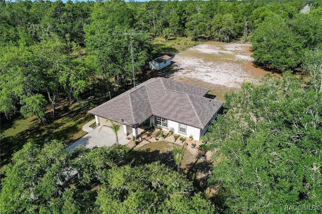 bird's eye view featuring a forest view