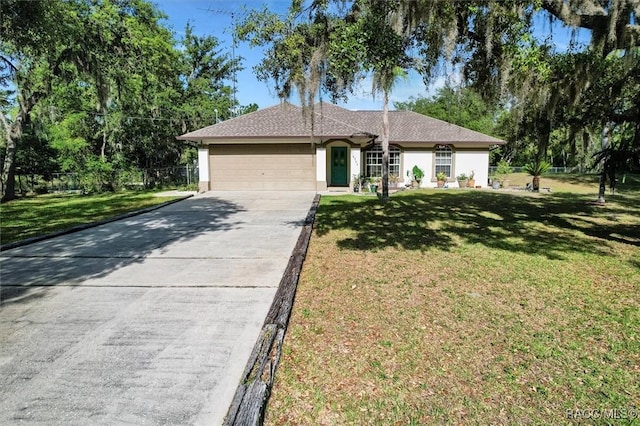 ranch-style house with concrete driveway, stucco siding, a front yard, and a garage
