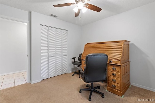 office with ceiling fan, visible vents, baseboards, and carpet