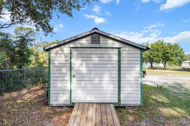 view of shed with fence