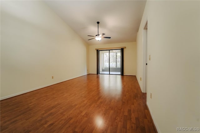 spare room featuring vaulted ceiling, ceiling fan, and hardwood / wood-style floors