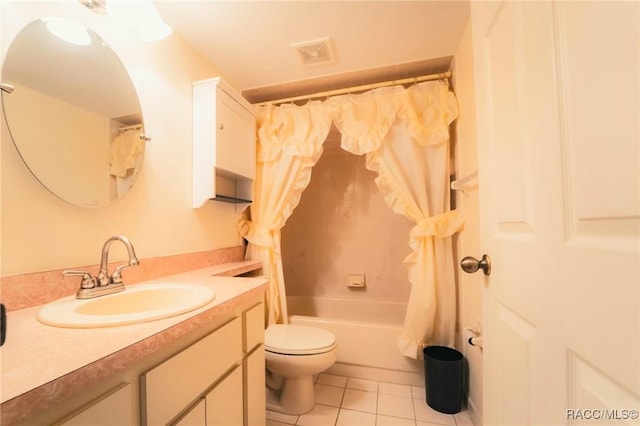 full bathroom featuring tile patterned flooring, vanity, shower / bath combo with shower curtain, and toilet