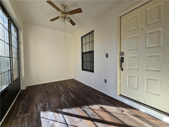 view of exterior entry with ceiling fan