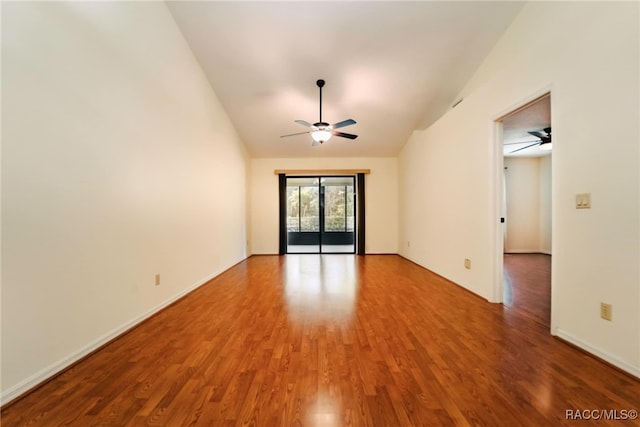 unfurnished room with ceiling fan, lofted ceiling, and hardwood / wood-style floors