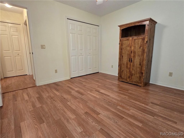 unfurnished bedroom featuring light wood-type flooring