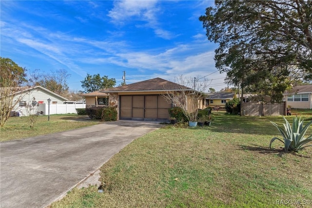 ranch-style home featuring a garage and a front yard