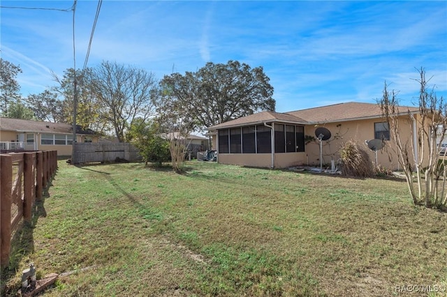 view of yard with a sunroom