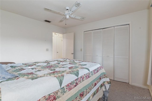 bedroom with carpet, ceiling fan, and a closet