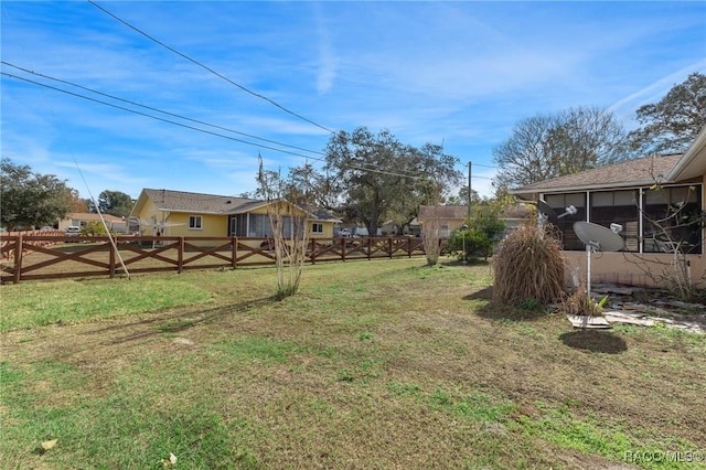 view of yard featuring a sunroom