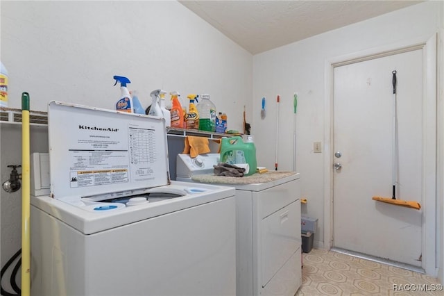 laundry area with washing machine and dryer