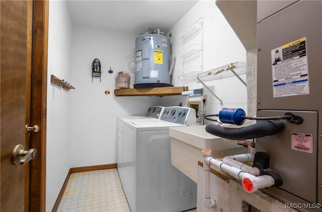 clothes washing area with independent washer and dryer and electric water heater