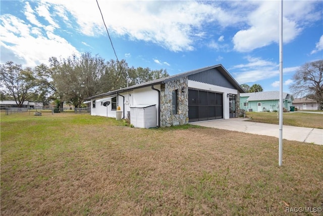 garage featuring a lawn