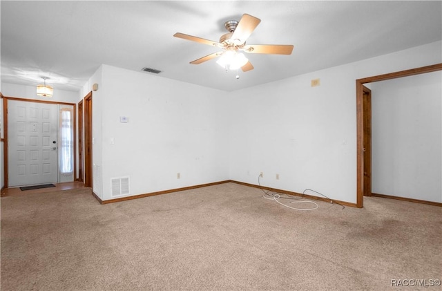 empty room with carpet floors and ceiling fan