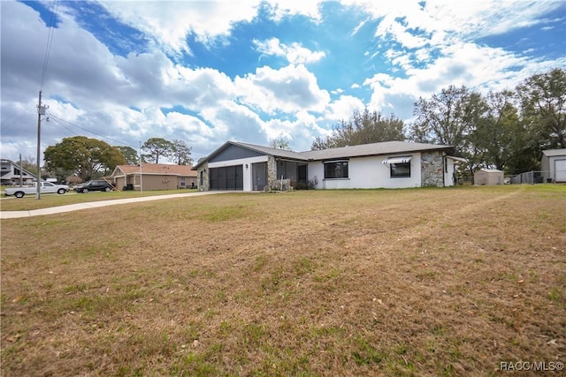 ranch-style house featuring a garage and a front yard