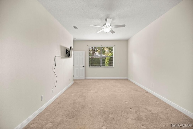 1825 W Caroline Path, Lecanto, FL 34461 - unfurnished room featuring light carpet, a ceiling fan, and a textured ceiling