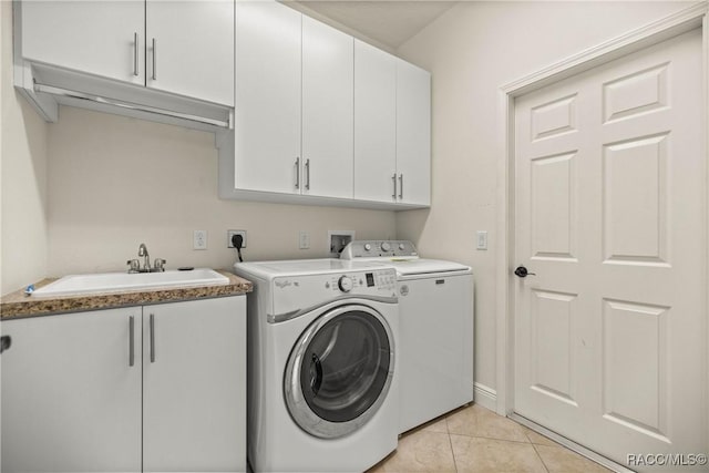 1825 W Caroline Path, Lecanto, FL 34461 - laundry area with washer and clothes dryer, cabinet space, and light tile patterned flooring