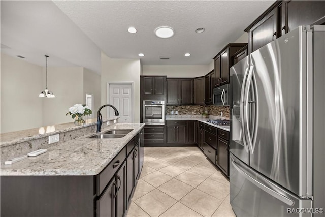 1825 W Caroline Path, Lecanto, FL 34461 - kitchen featuring stainless steel appliances, tasteful backsplash, light stone countertops, dark brown cabinets, and a chandelier