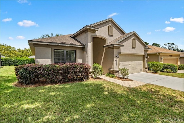 1825 W Caroline Path, Lecanto, FL 34461 - view of front of property with stucco siding, driveway, and a front yard