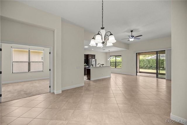 1825 W Caroline Path, Lecanto, FL 34461 - unfurnished living room with a chandelier, light tile patterned flooring, a ceiling fan, light colored carpet, and recessed lighting