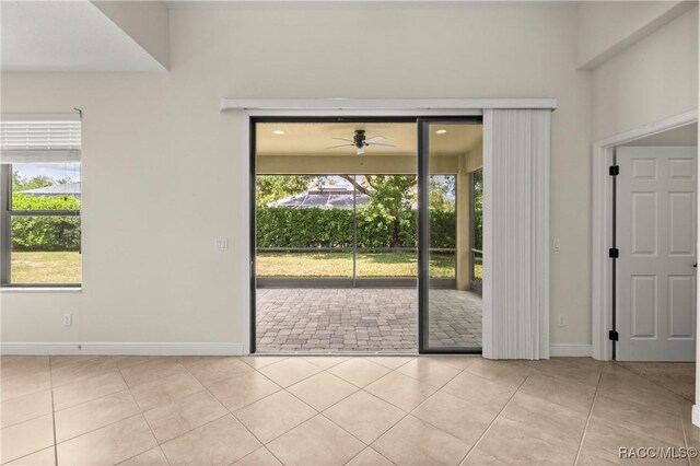 1825 W Caroline Path, Lecanto, FL 34461 - tiled empty room with plenty of natural light and a ceiling fan