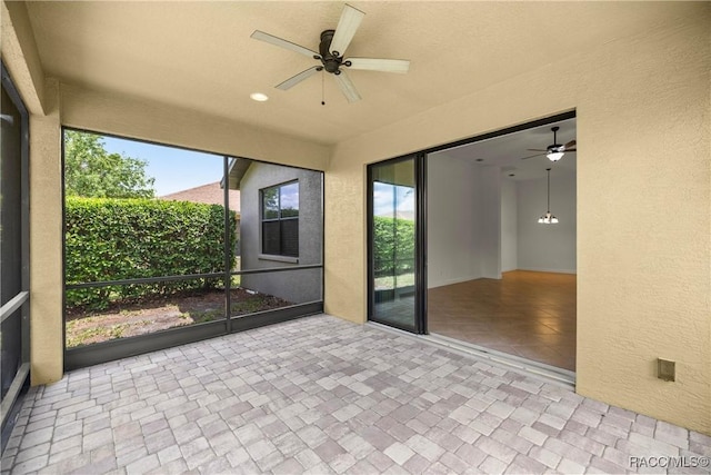 1825 W Caroline Path, Lecanto, FL 34461 - unfurnished sunroom with a ceiling fan and healthy amount of natural light