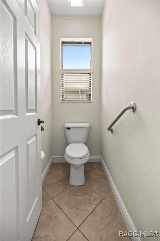 1825 W Caroline Path, Lecanto, FL 34461 - bathroom with toilet and tile patterned flooring