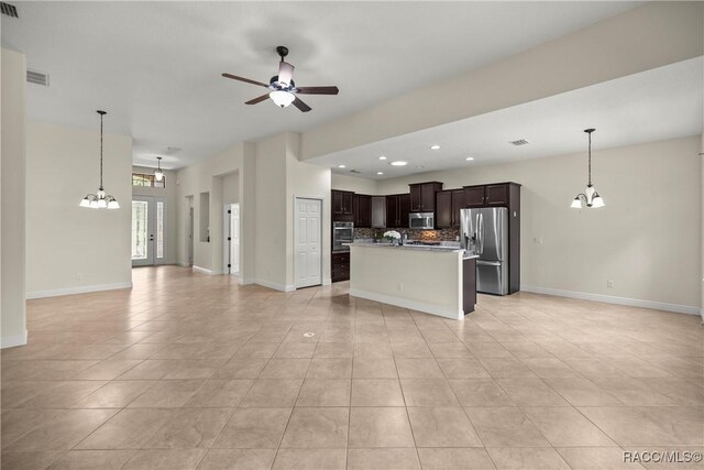 1825 W Caroline Path, Lecanto, FL 34461 - unfurnished living room featuring a chandelier, light tile patterned flooring, a ceiling fan, and recessed lighting