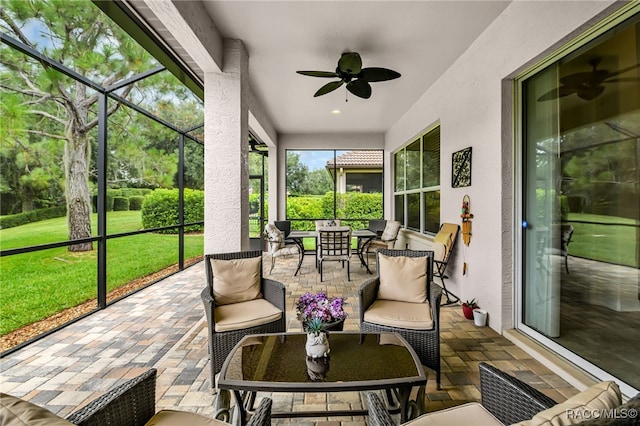 sunroom with ceiling fan