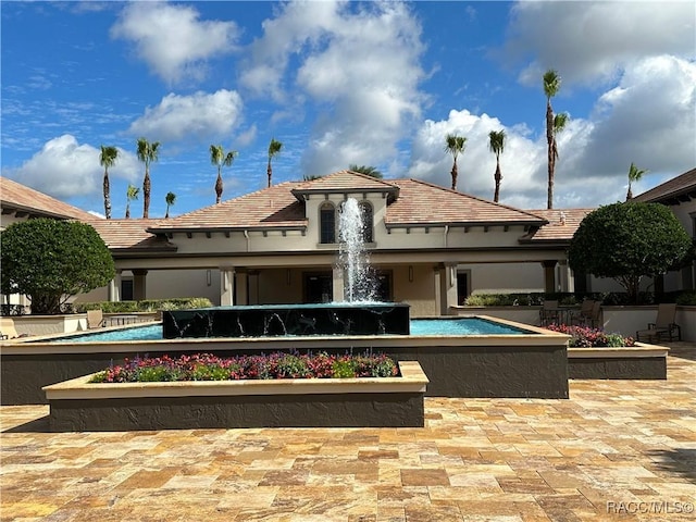 view of community featuring a patio and a swimming pool