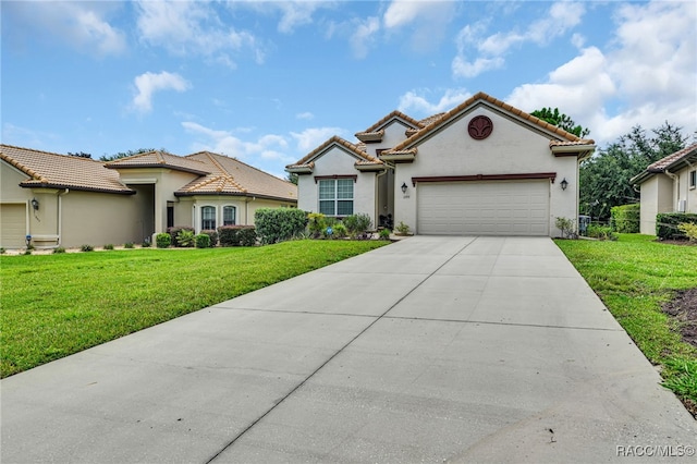 mediterranean / spanish-style house with a garage, driveway, a tile roof, and a front lawn