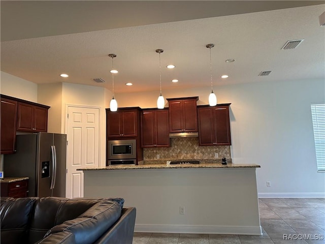 kitchen featuring visible vents, baseboards, appliances with stainless steel finishes, backsplash, and light stone countertops