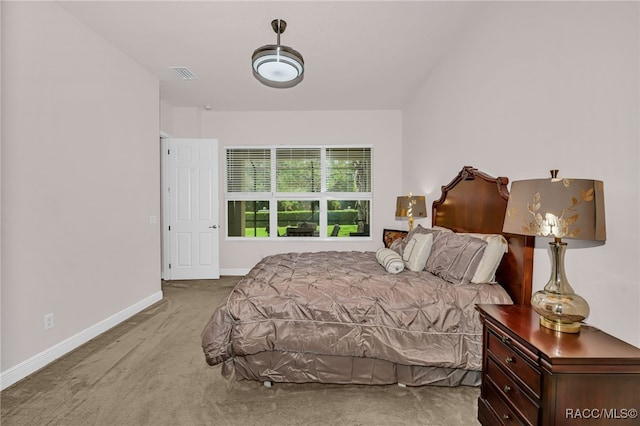 bedroom with carpet floors, visible vents, and baseboards