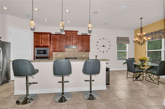 kitchen with light stone countertops, stainless steel appliances, wine cooler, backsplash, and light tile patterned flooring