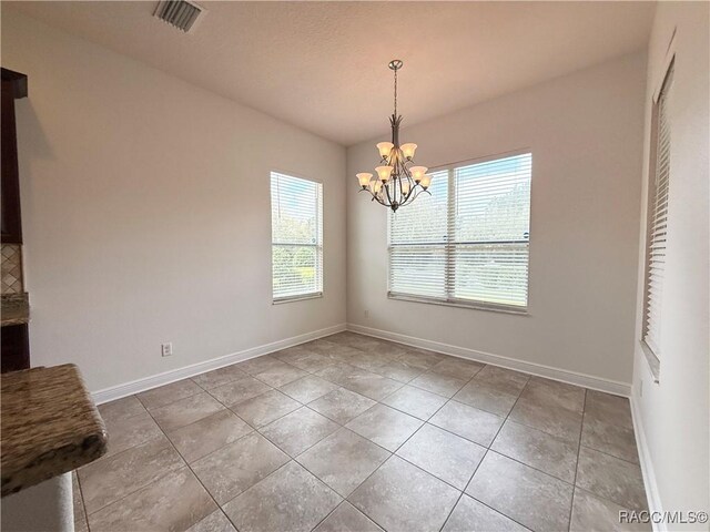 kitchen featuring wine cooler, decorative backsplash, light stone countertops, and appliances with stainless steel finishes