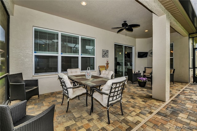 view of patio with outdoor lounge area, a ceiling fan, and outdoor dining space