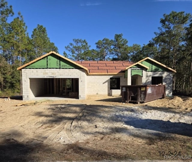 property in mid-construction with a garage