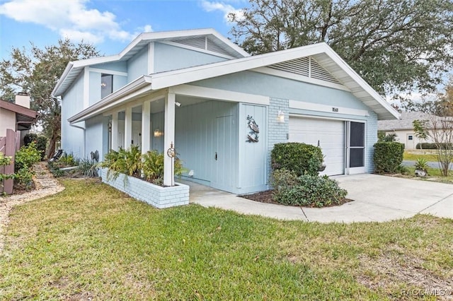 view of side of home with a garage and a yard