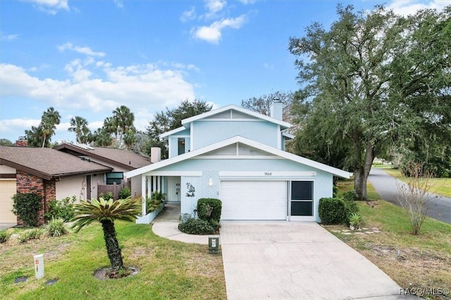 view of front of home featuring a front lawn and a garage