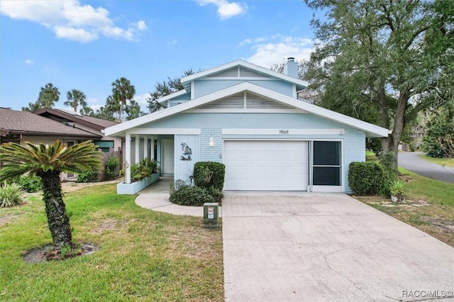 view of front of house with a front yard and a garage