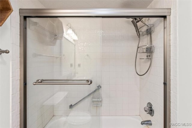 bathroom featuring enclosed tub / shower combo