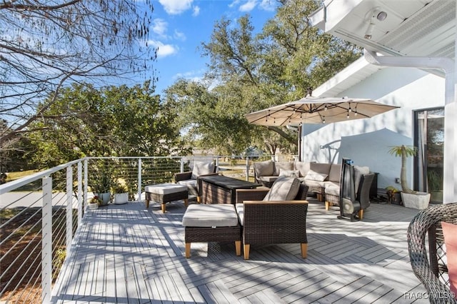 wooden terrace featuring outdoor lounge area