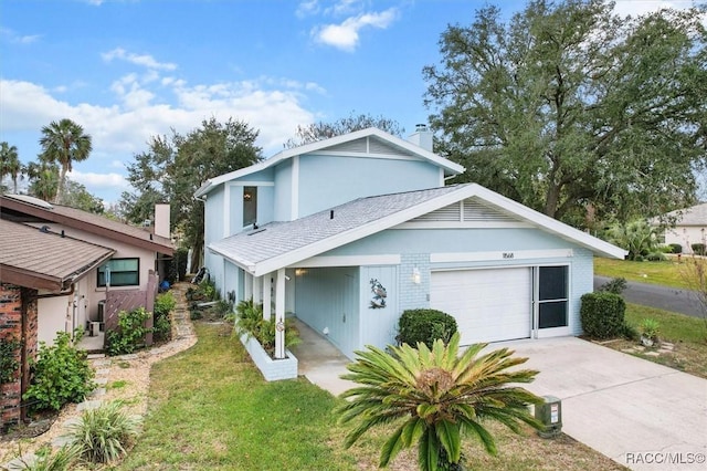 view of front of property with a front lawn and a garage