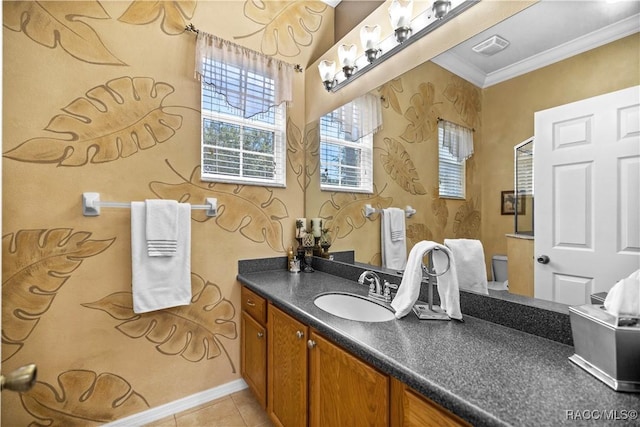 bathroom featuring toilet, vanity, tile patterned floors, and crown molding