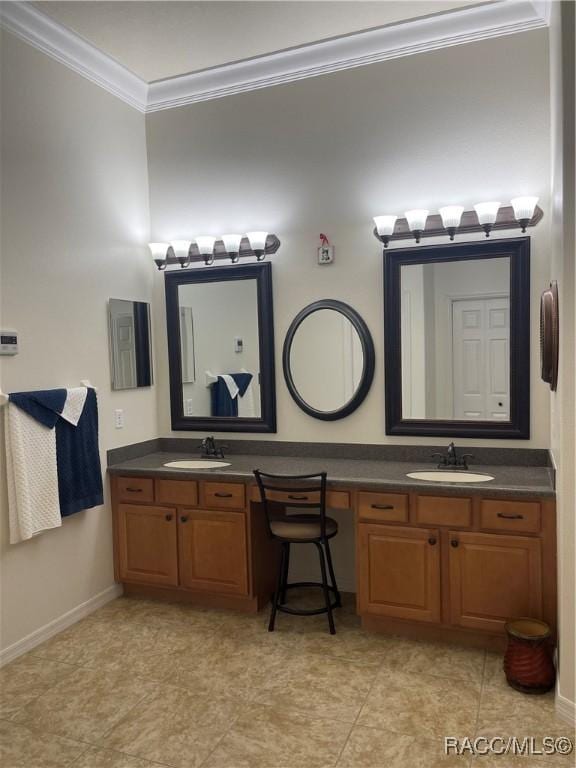 bathroom with tile patterned floors, vanity, and ornamental molding