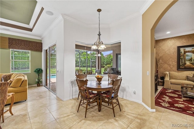 dining area featuring light tile patterned floors, crown molding, and a notable chandelier