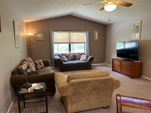 living room featuring ceiling fan, light colored carpet, a textured ceiling, and vaulted ceiling