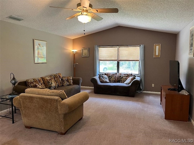 carpeted living room with a textured ceiling, ceiling fan, and lofted ceiling