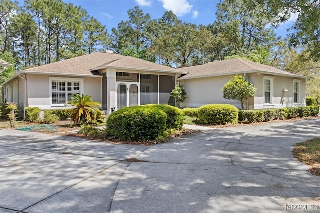 3563 W Blossom Dr, Beverly Hills, FL 34465 - single story home with stucco siding and driveway